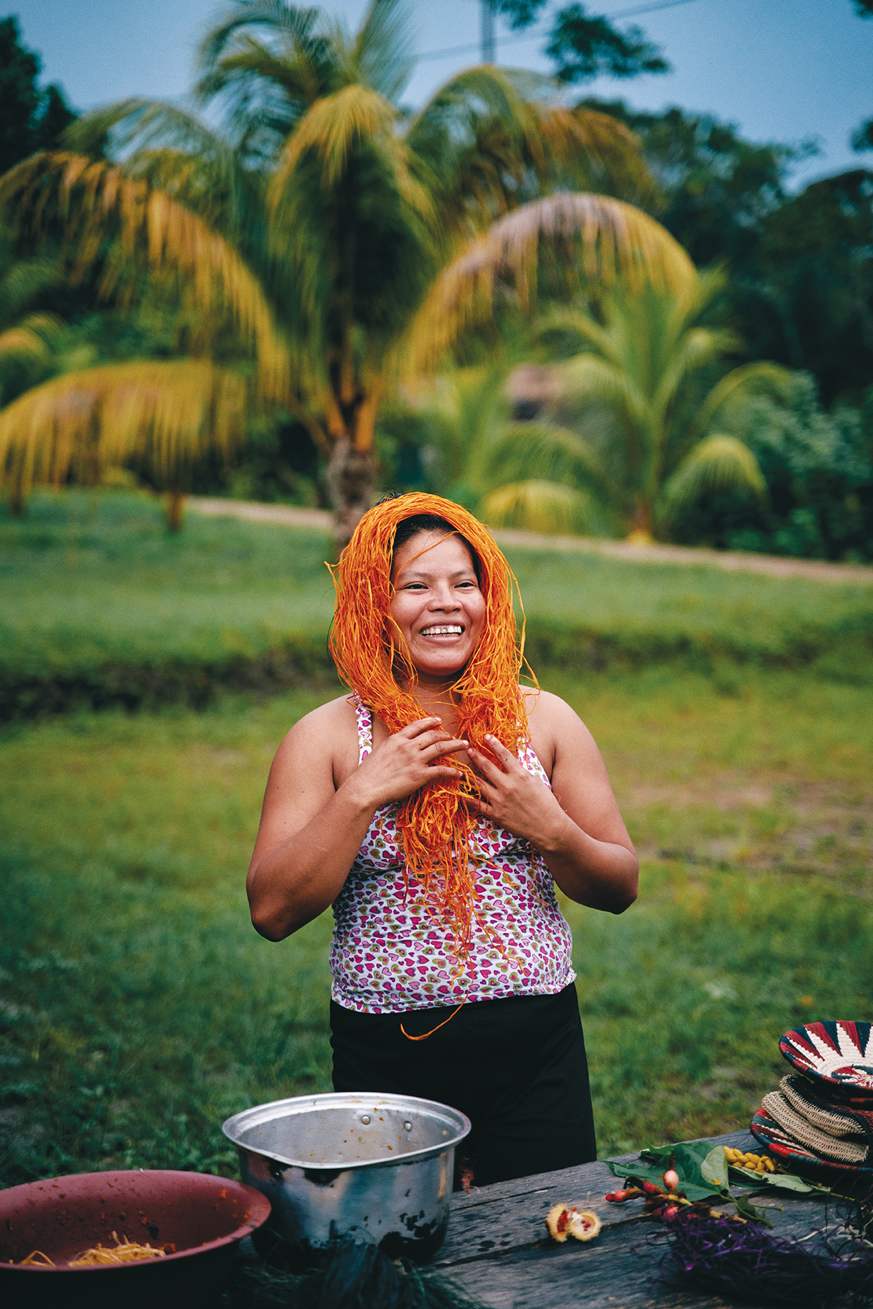 Peruvian woman with dyed grasses