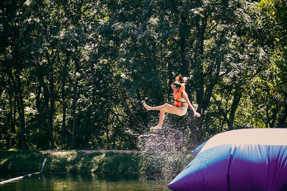 Girls at Camp Texas Jumping on a Blob